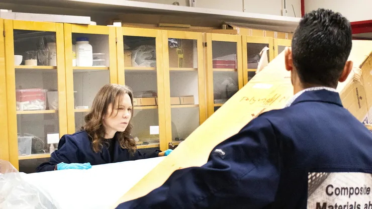 Female and male researchers in lab.