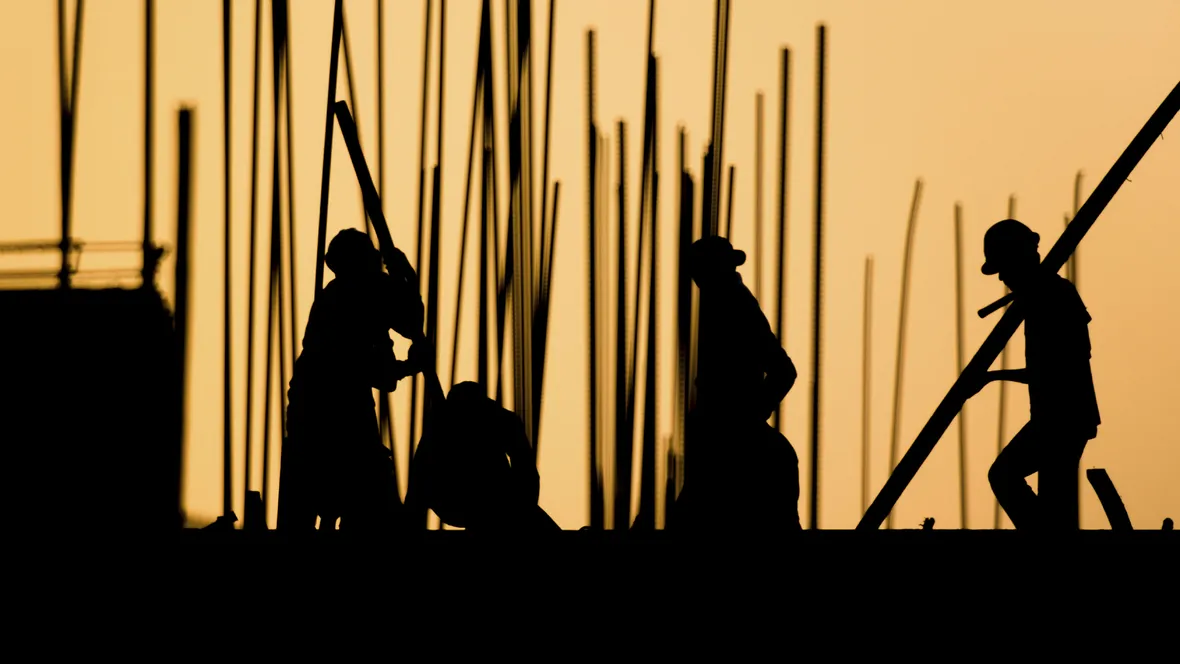 Contractors in silhouette