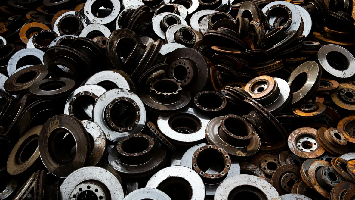 A diverse assortment of metal parts stacked together, showcasing various sizes and shapes in a disorganized manner.