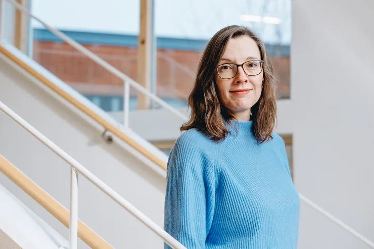 Corinna Röver standing on a stair.