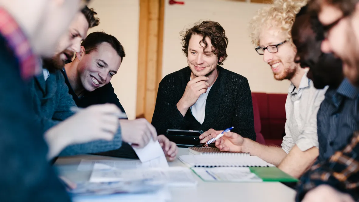 A group of people working around a table