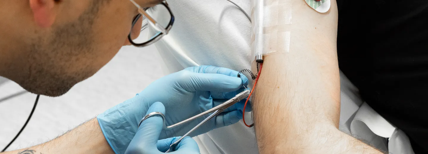 A researcher working with a test subject.