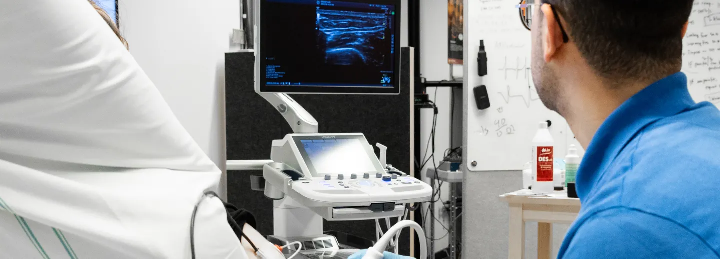 A researcher working with a test subject.