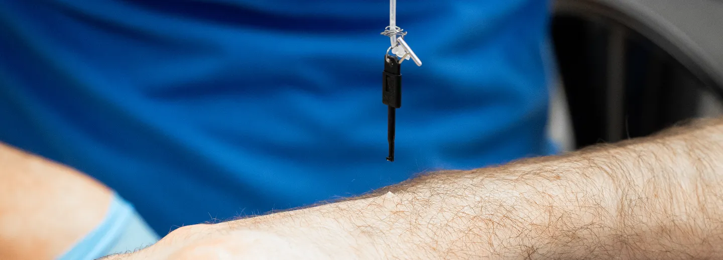 A researcher working with a test subjects skinn.