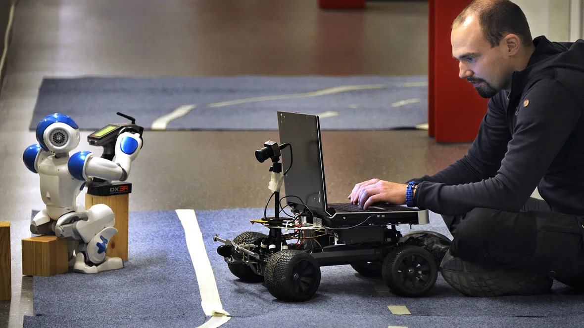 Robot and researcher.