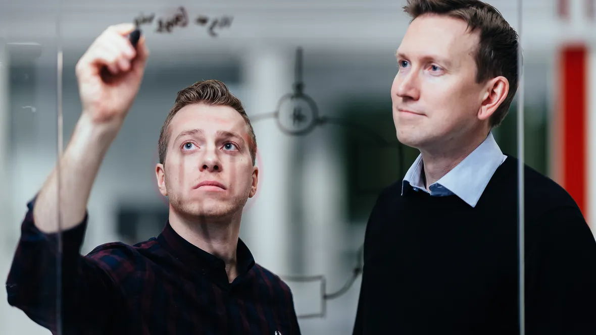 Researchers working on calculation.