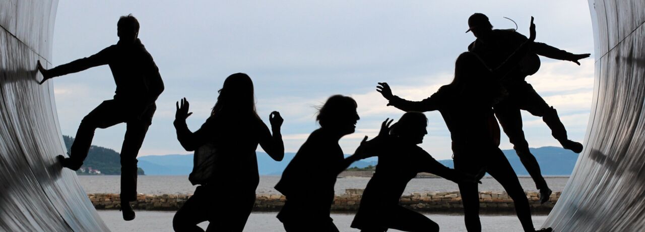 Youth in silhouette in a pipe