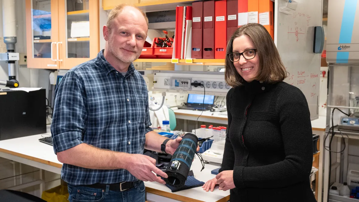 Male and female researcher in a lab.