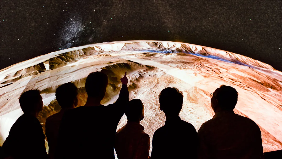 People watching a big screen