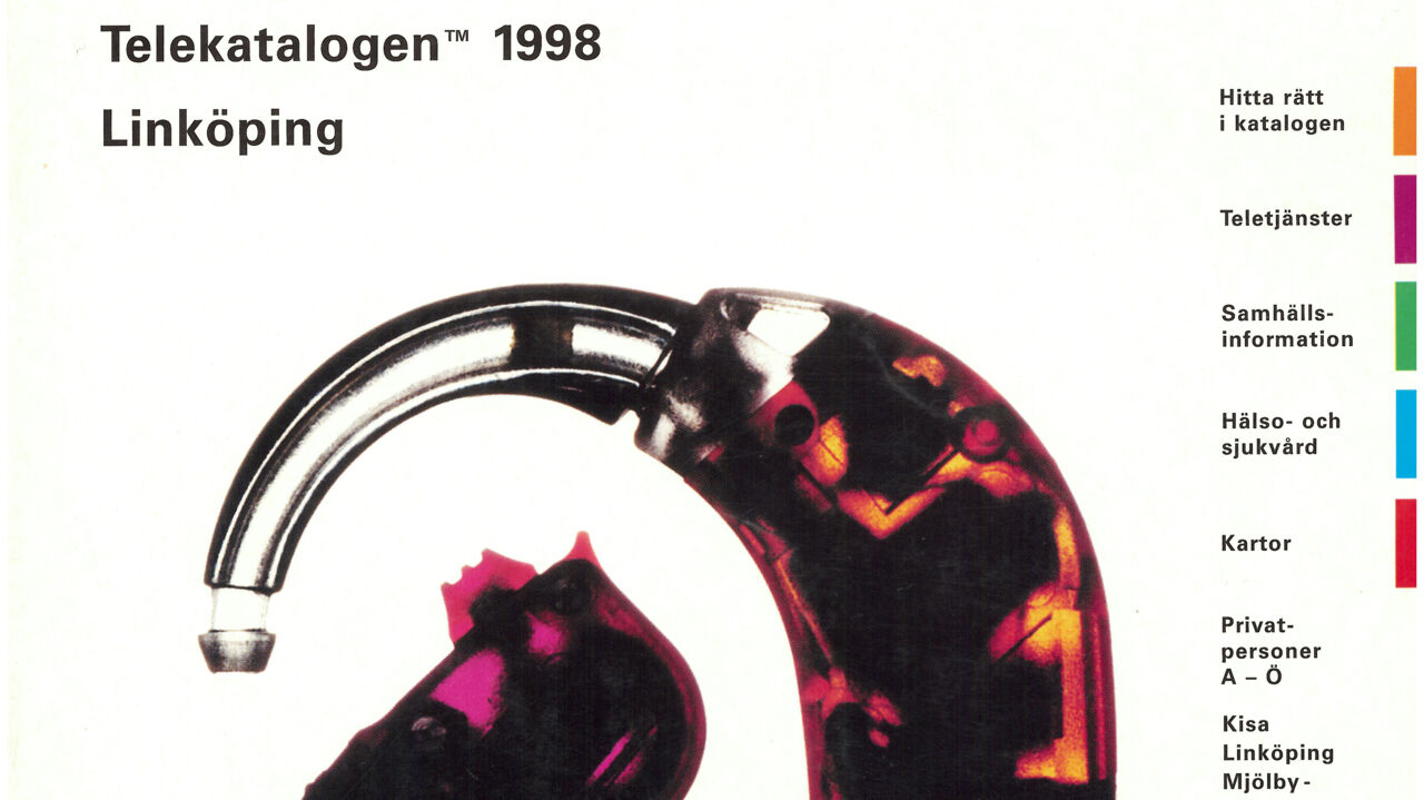 Telefonkatalog med digital hörapparat på framsidan, detalj