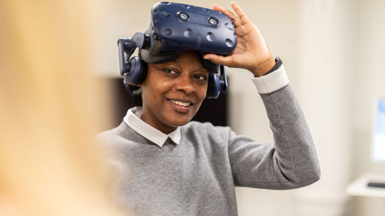 Emma with VR headset on her head