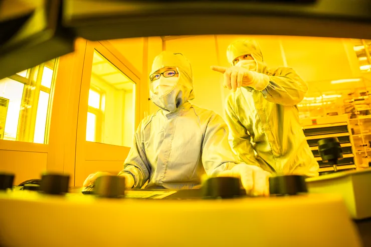 Two researches in the clean room.