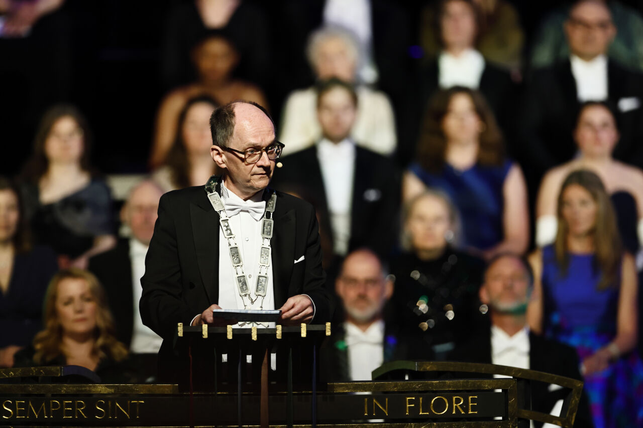 A man in formal wear on stage