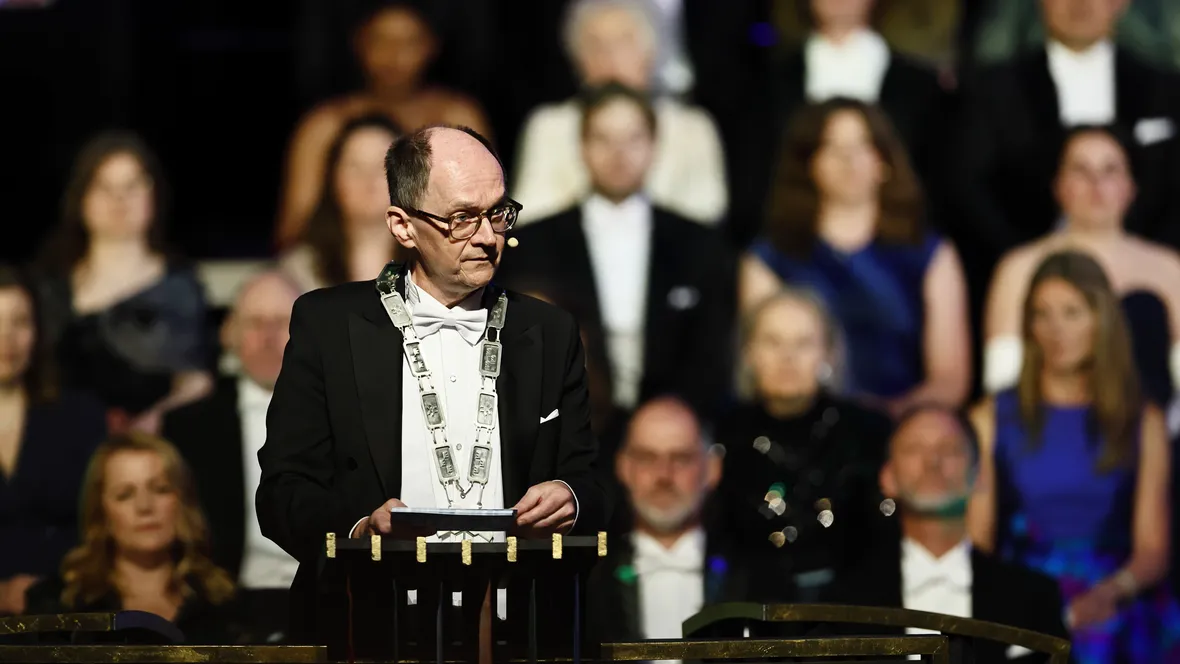 A man in formal wear on stage
