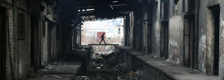 Man in refugee camp behind the Belgrade Central Station