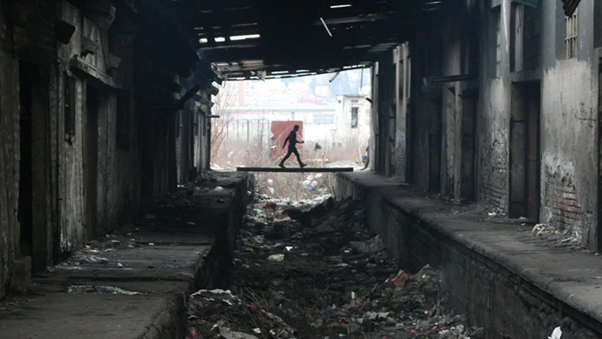 Man in refugee camp behind the Belgrade Central Station