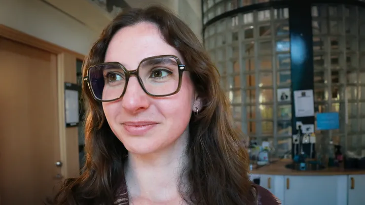 Female PhD-student, brown hair.