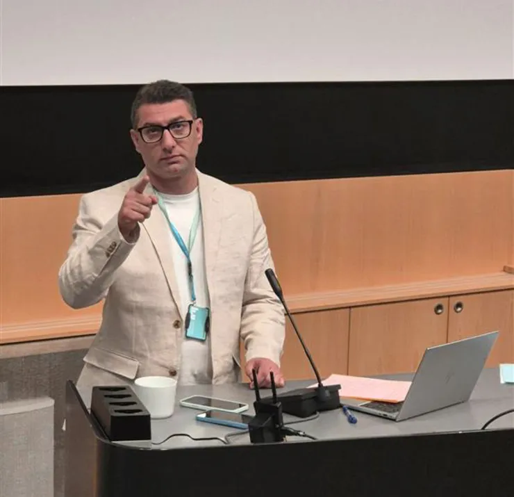 man standing at lectern