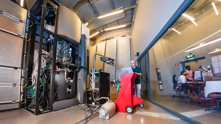 Scientists at electron microscope