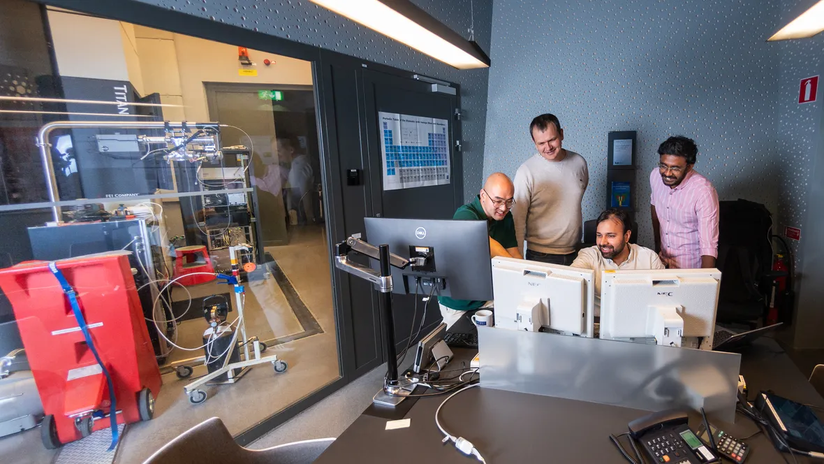 Picture of researchers using a transmission electron microscope