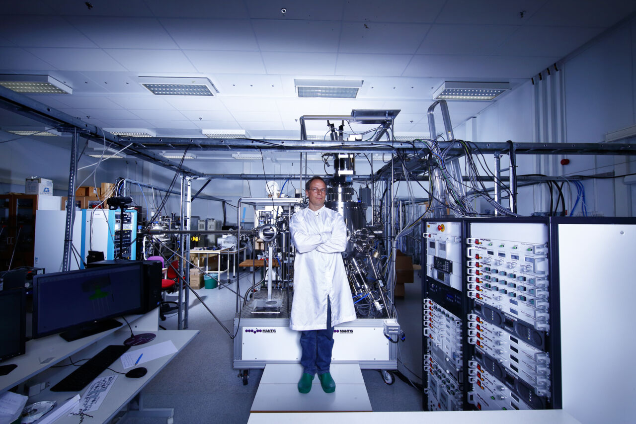 male researcher standing in material laboratory.
