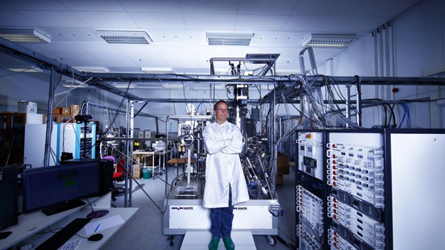male researcher standing in material laboratory.