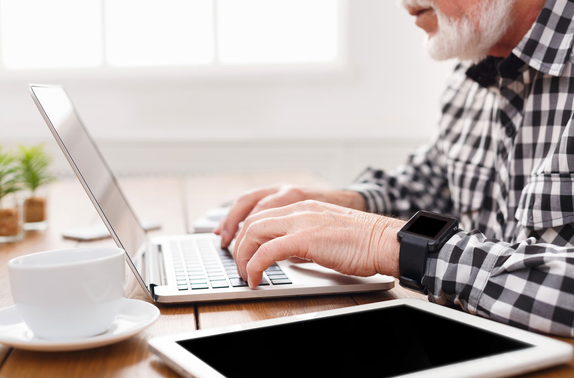 Elderly man at computer