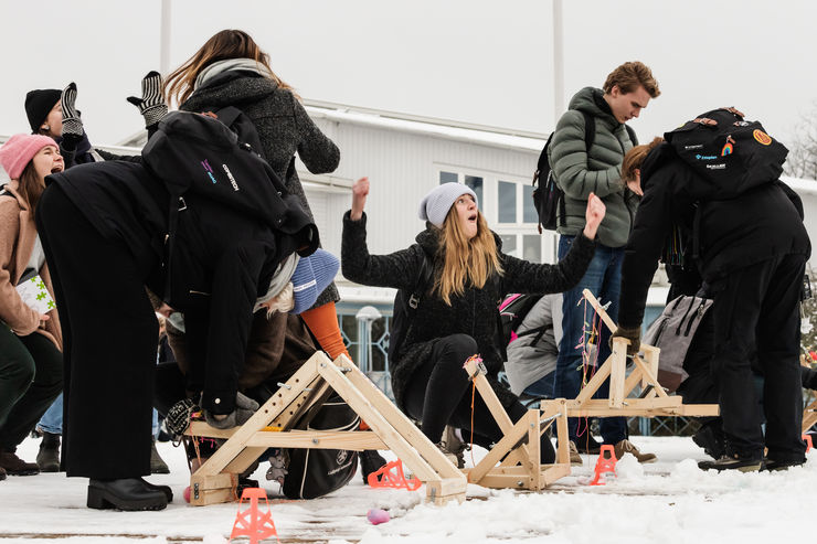 Students with catapults in snow