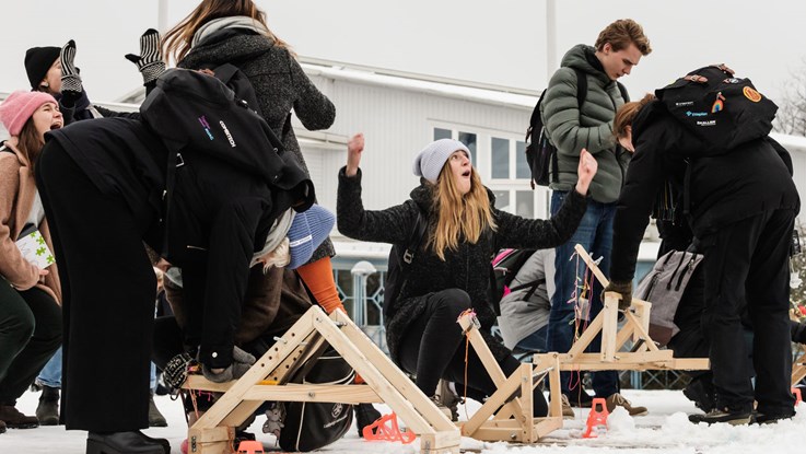 Students with catapults in snow