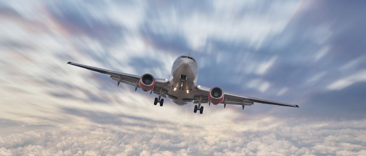 Airplane flying over clouds