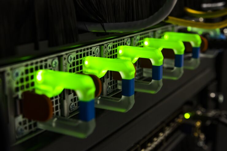 Green lights on the backside of a supercomputer.