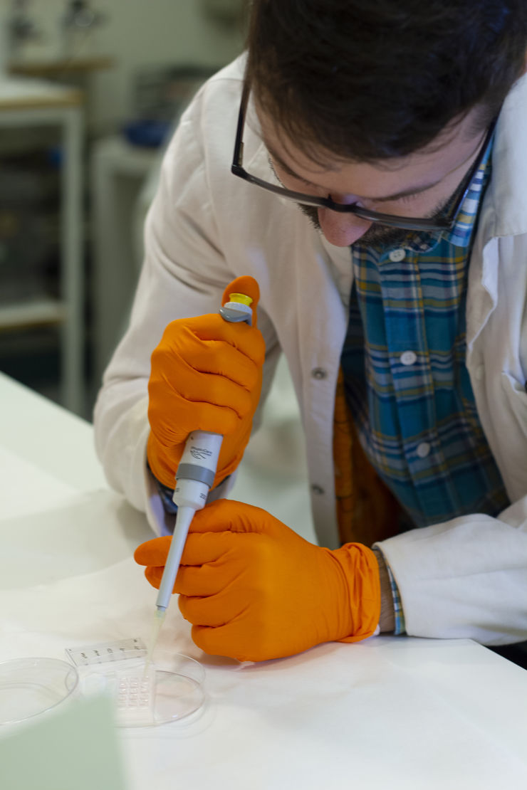 young man in lab coat works with the hydrogel