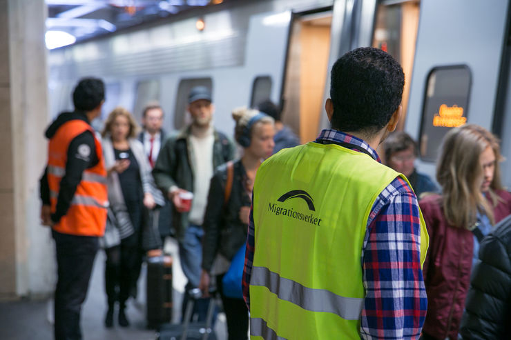 refugees at train station in Sweden