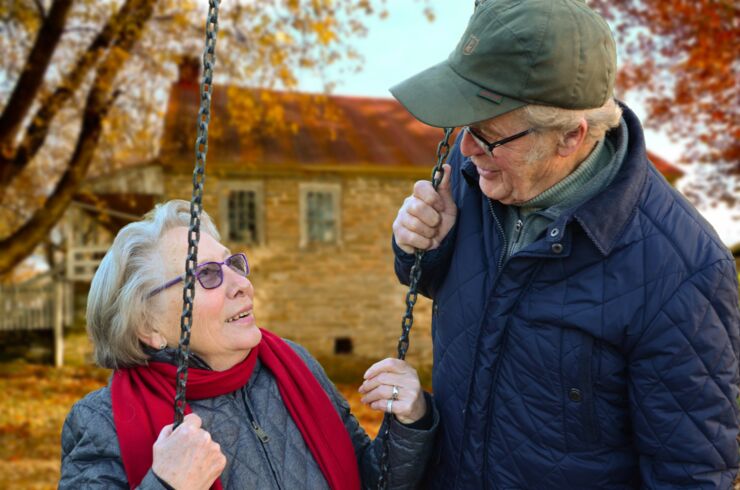 Elderly couple looking at each other, outdoors
