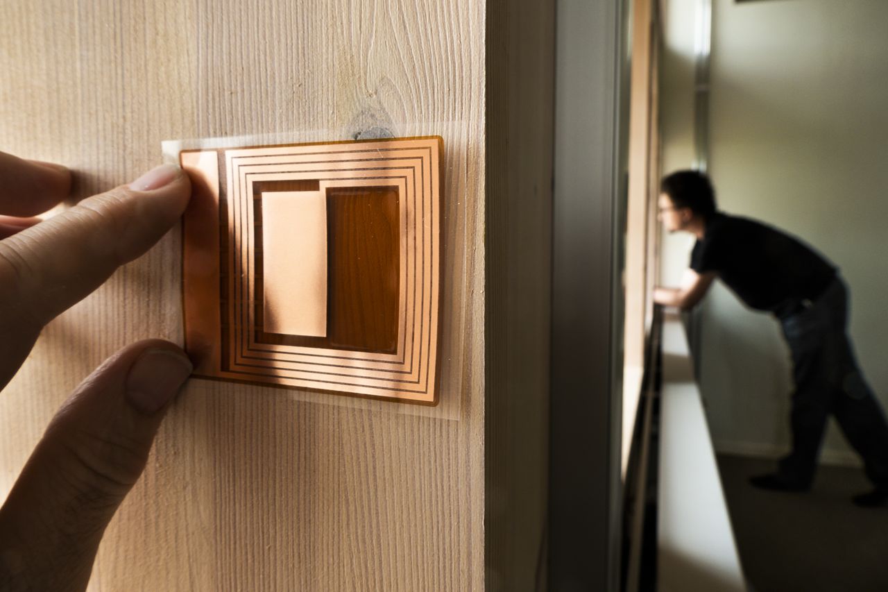 Sensors are placed on a wooden wall