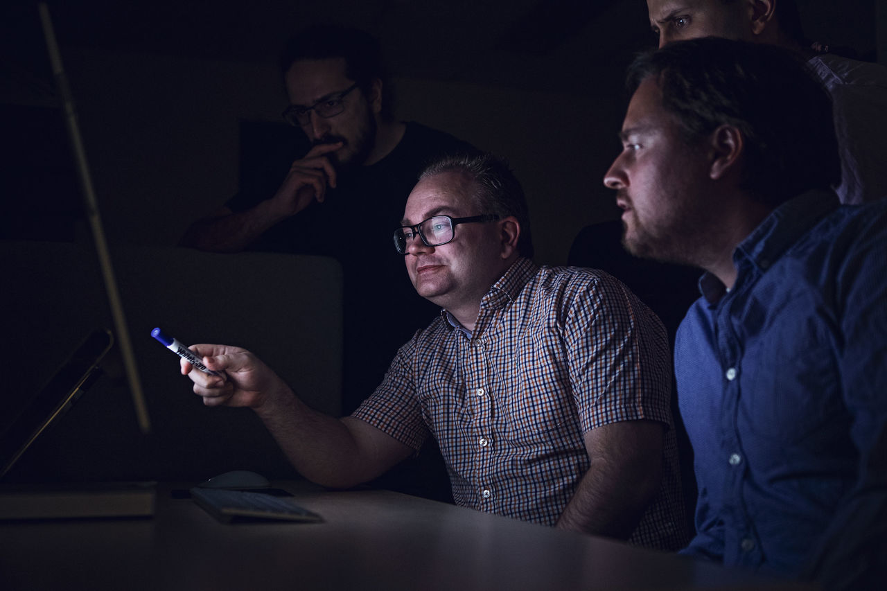 Researchers in front of computer