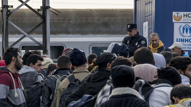 Sid, Serbia - November 14, 2015: Refugees waiting to board a train to Croatia in Sid (Serbia)