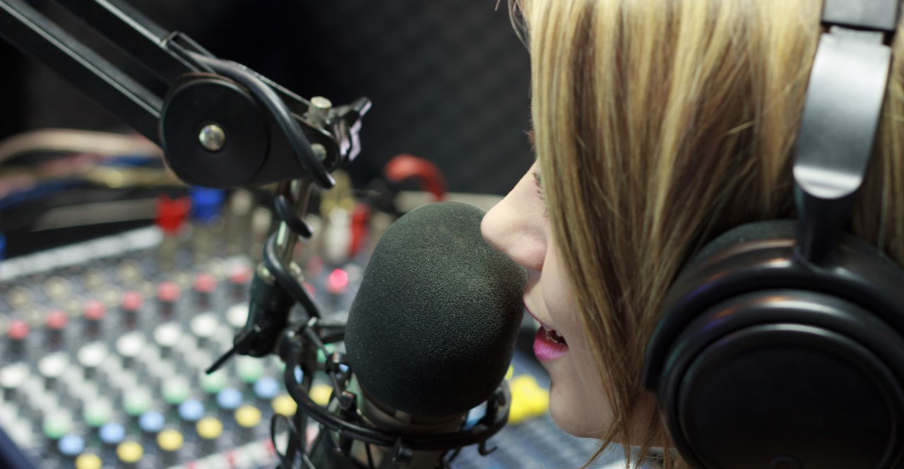 Beautiful Woman Working As Radio DJ Live In Studio