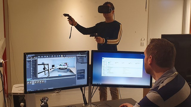 A person testing virtual reality glasses