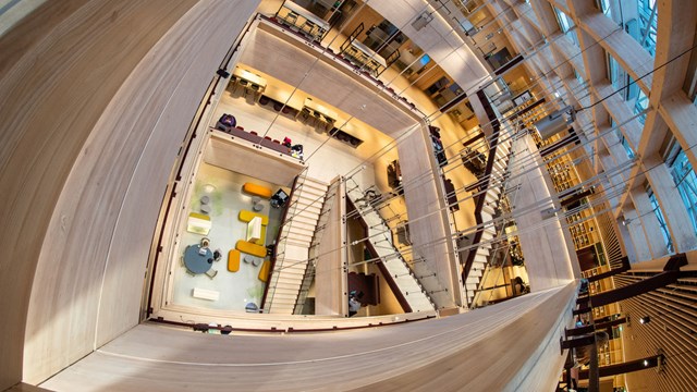 A overhead view of a starecase connecting four floors in a building.
