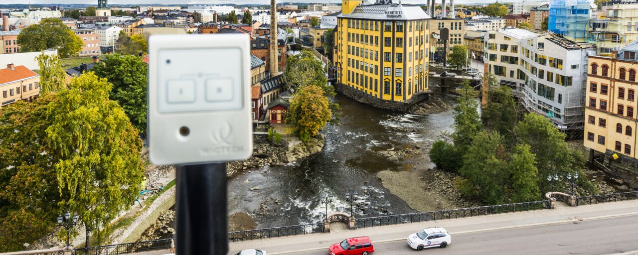 Electronics in the foreground of an aerial picture of industrilandskapet in Norrköping