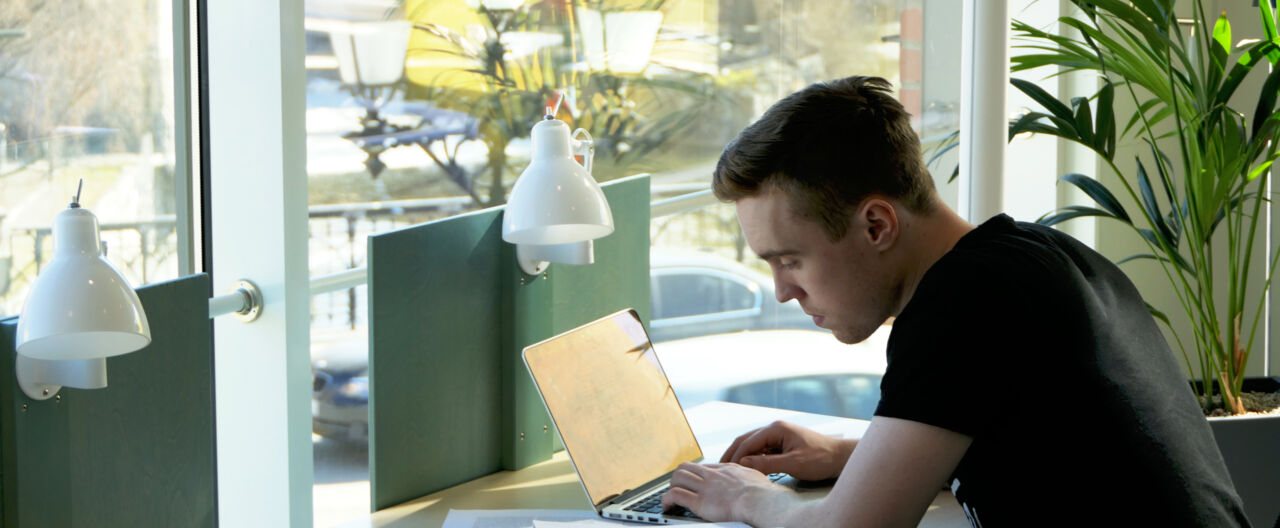 Person studying in front of a window