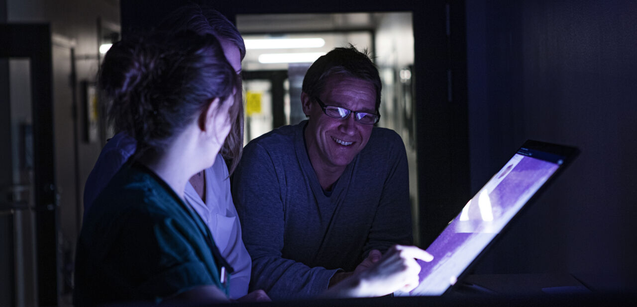 Researchers around a computer.