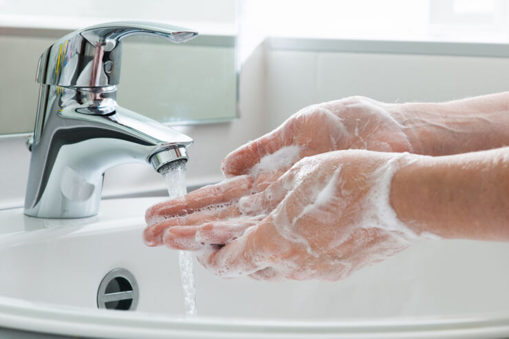 A person washing hands