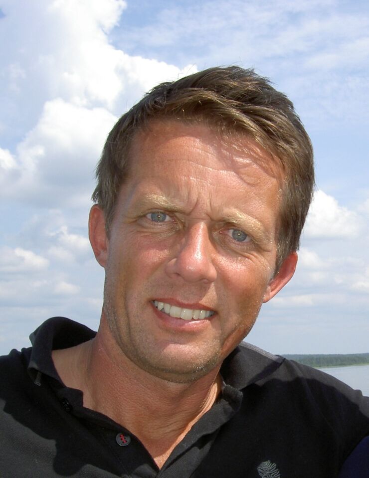 Portrait of man with a tan, blue sky in the background