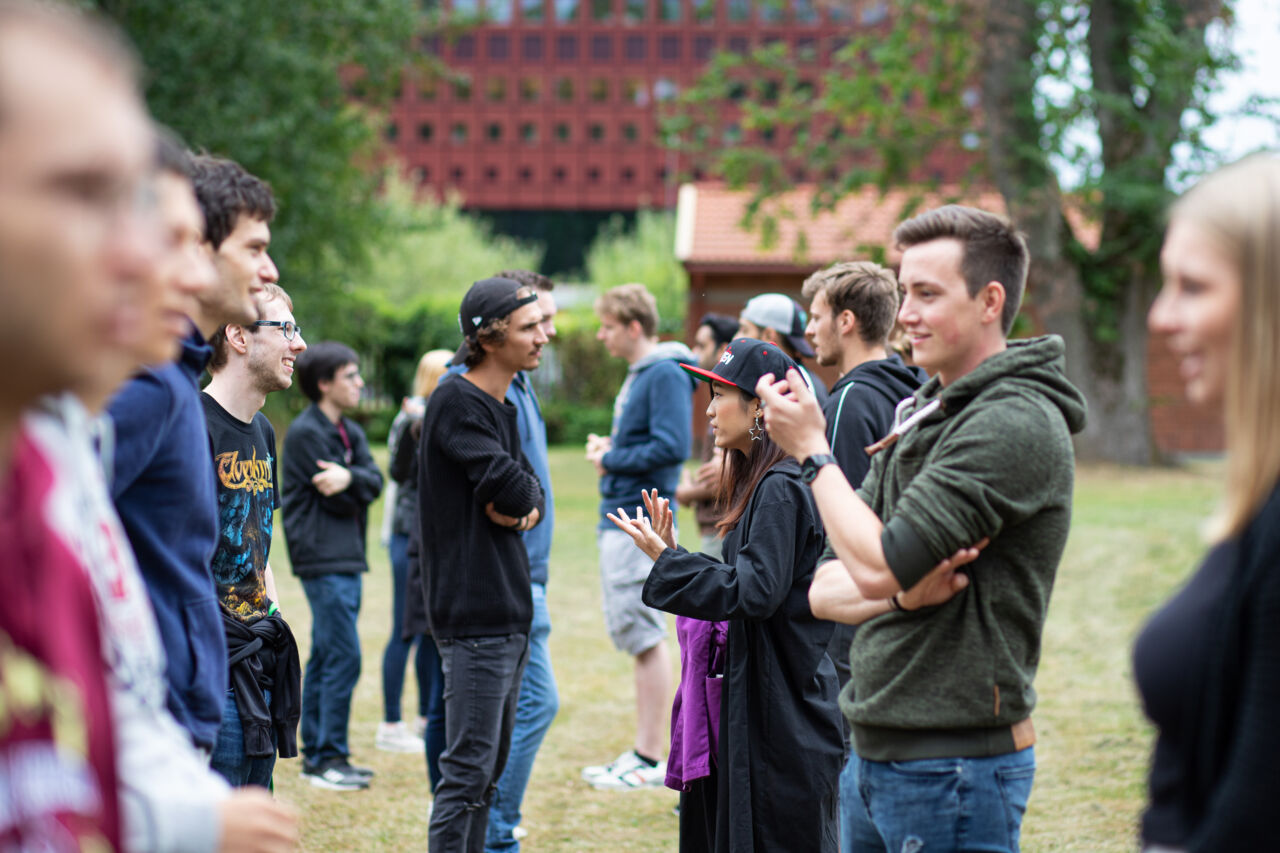 Boys and girls talking outdoors