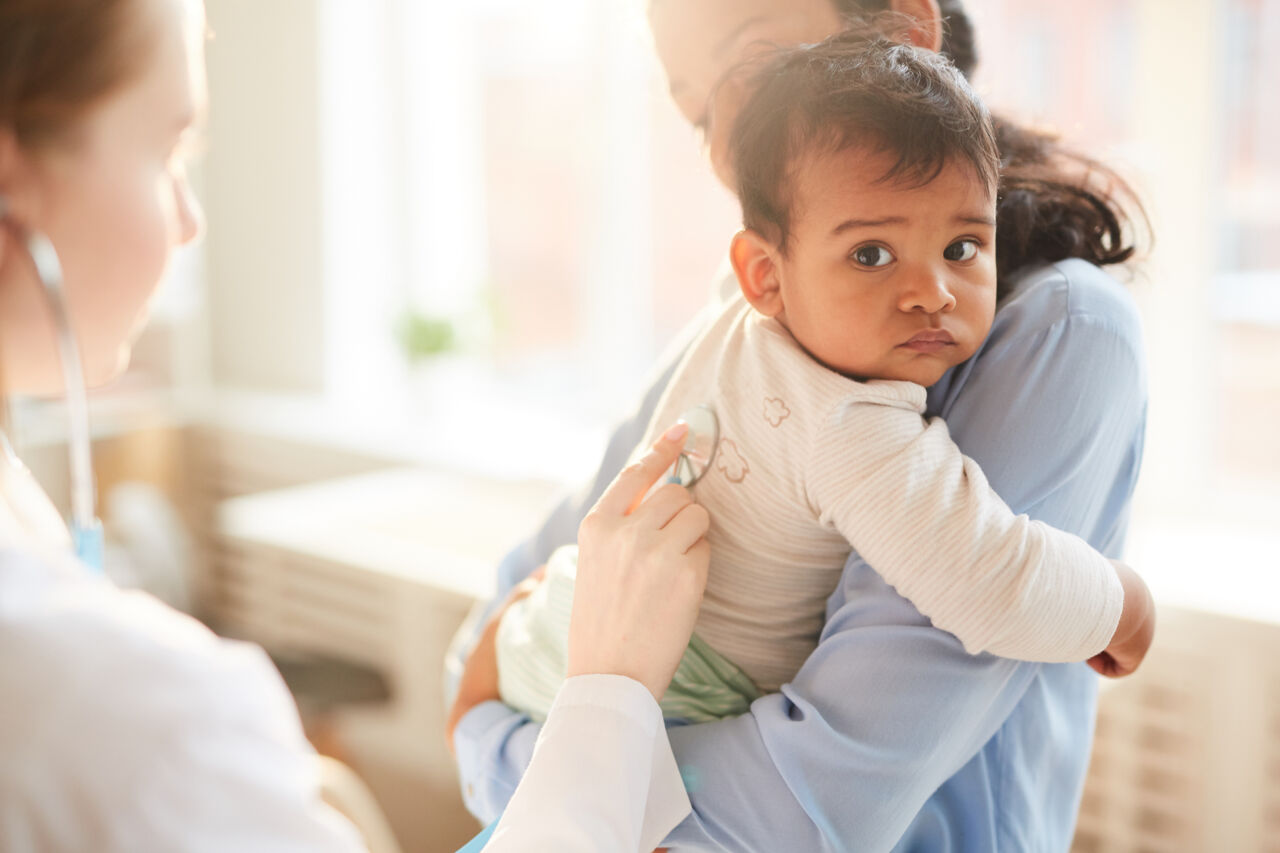 Doctor examining a child.