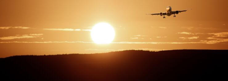 Aircraft landing, sunset
