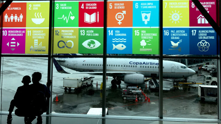 An airport with the UN sustainability goals at the widow