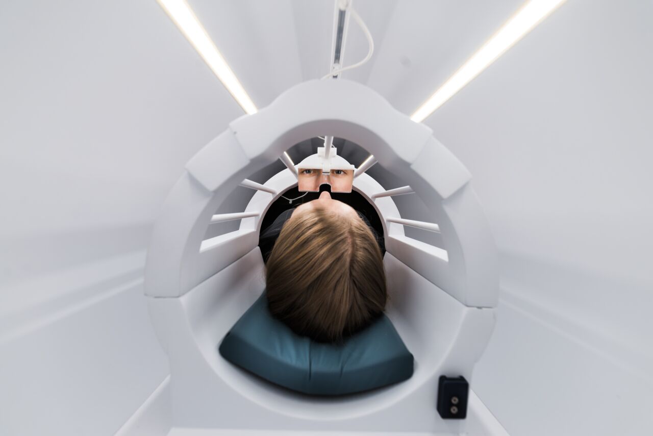 A women is doing computed tomography.